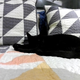 The photo is blurry like the camera is smudged, all the detail is lost from the cat’s fur, and parts of the image are totally blown out. Yikes.
